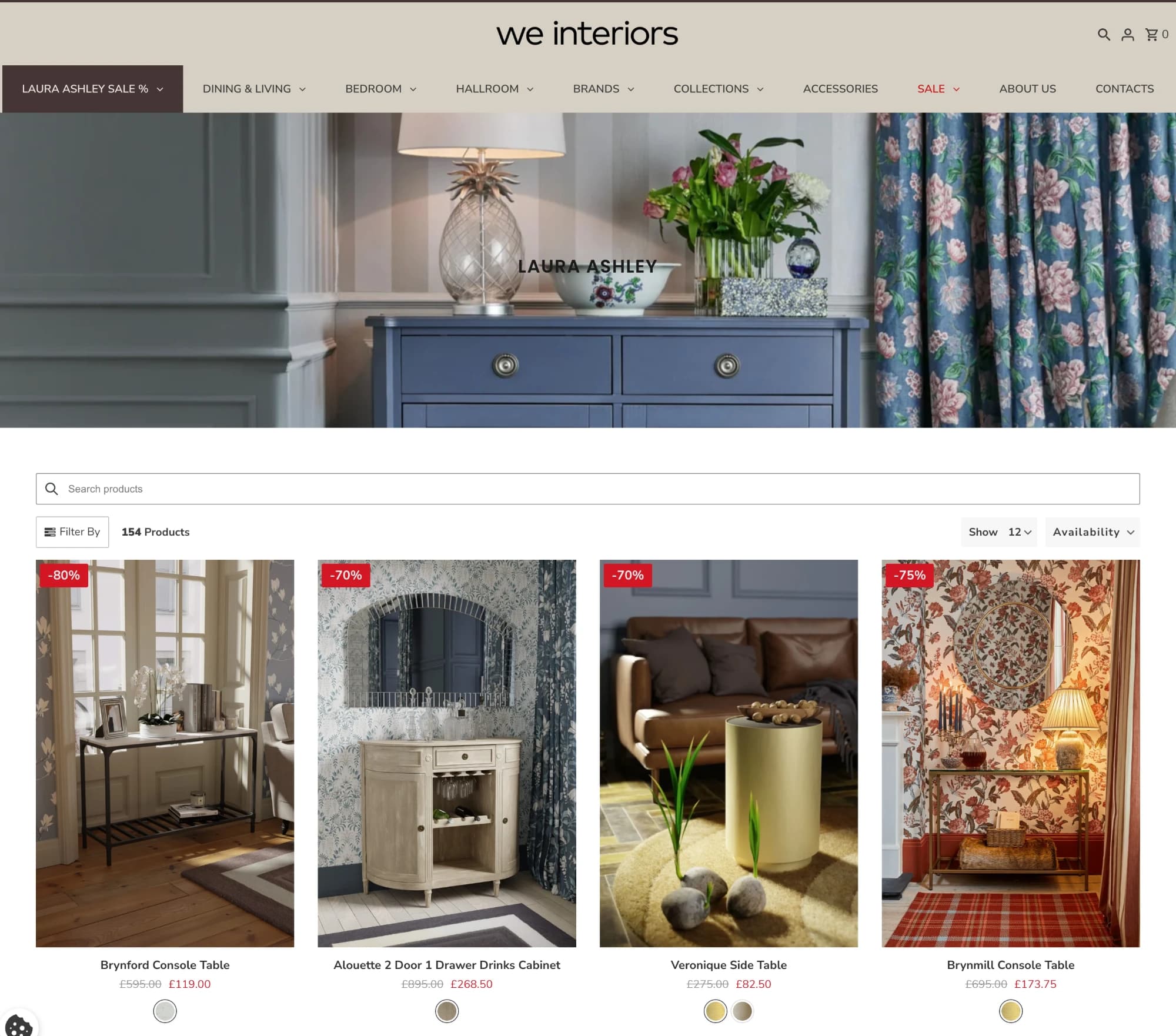 We Interiors storefront showing the Laura Ashley collection, 154 products, with console tables and cabinets discounted between 70 and 80 percent.